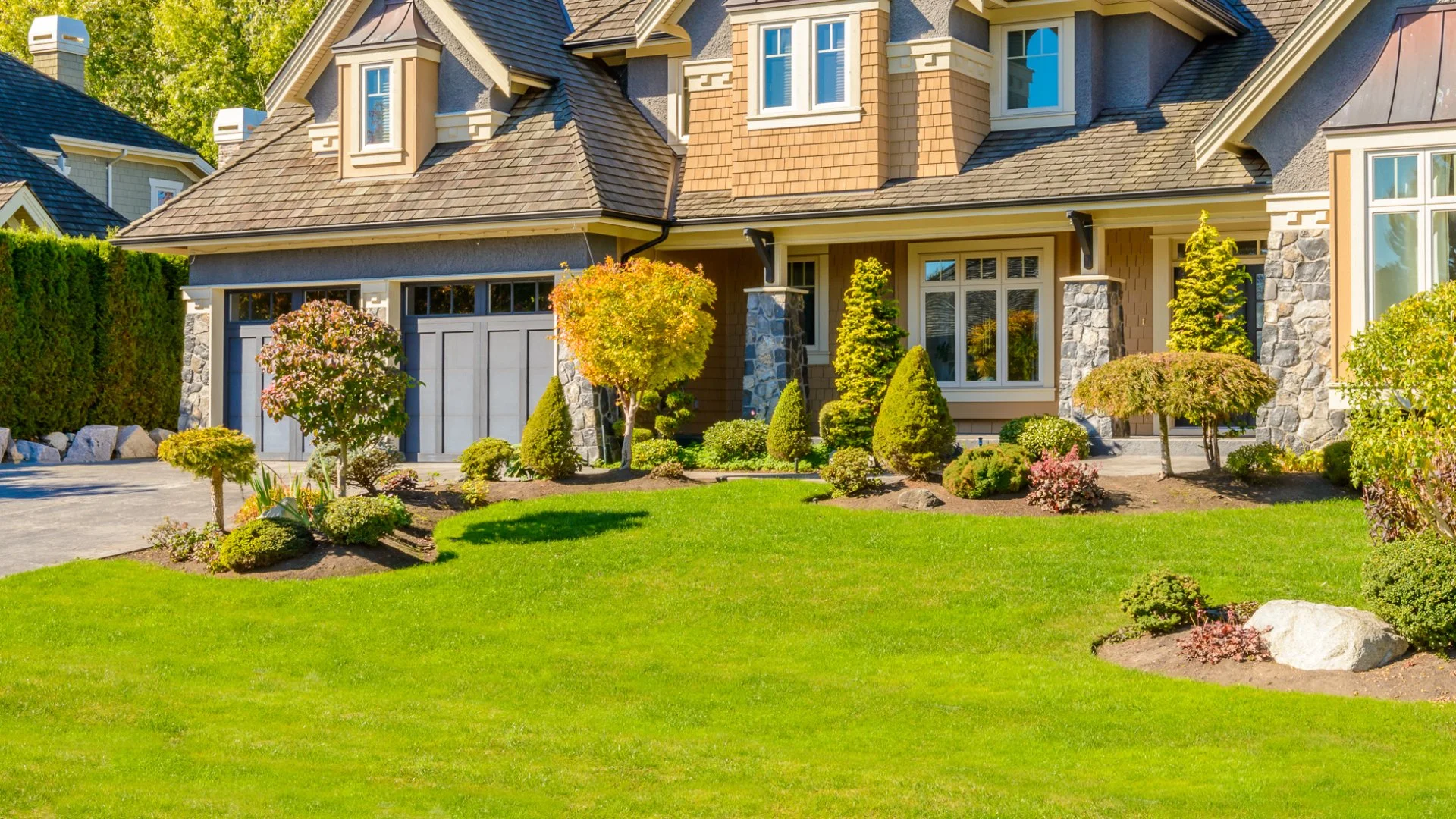 A home with beautiful green lawn and landscaping due to our services in Kennett Square, PA. 