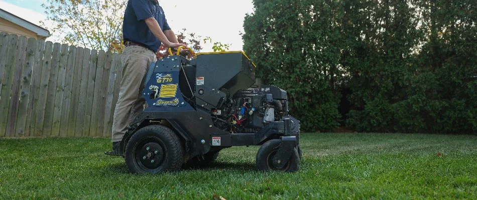 Tech aerating a lawn in Doylestown, PA.