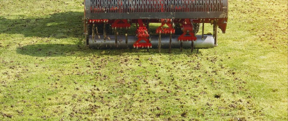 A red aeration machine at work on a property in Malvern, PA. 