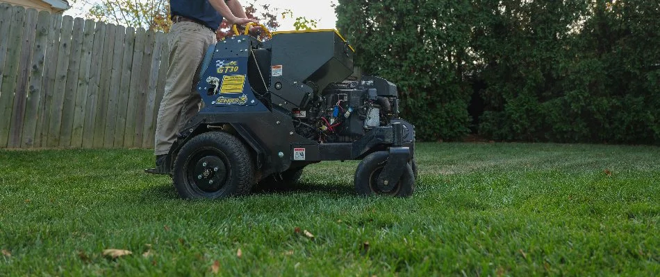 Crew on a core aerator machine in Glasgow, DE.