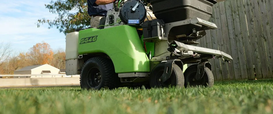 Fertilizer spreader machine on a lawn in Villanova, PA.