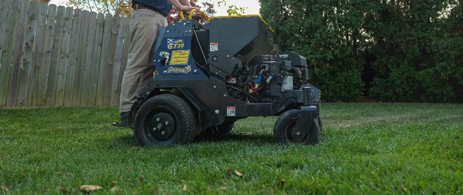 Man fertilizing a lawn in Upper Chichester Township, PA.