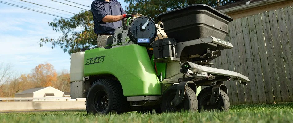 Worker riding on lawn care equipment in Phoenixville, PA.